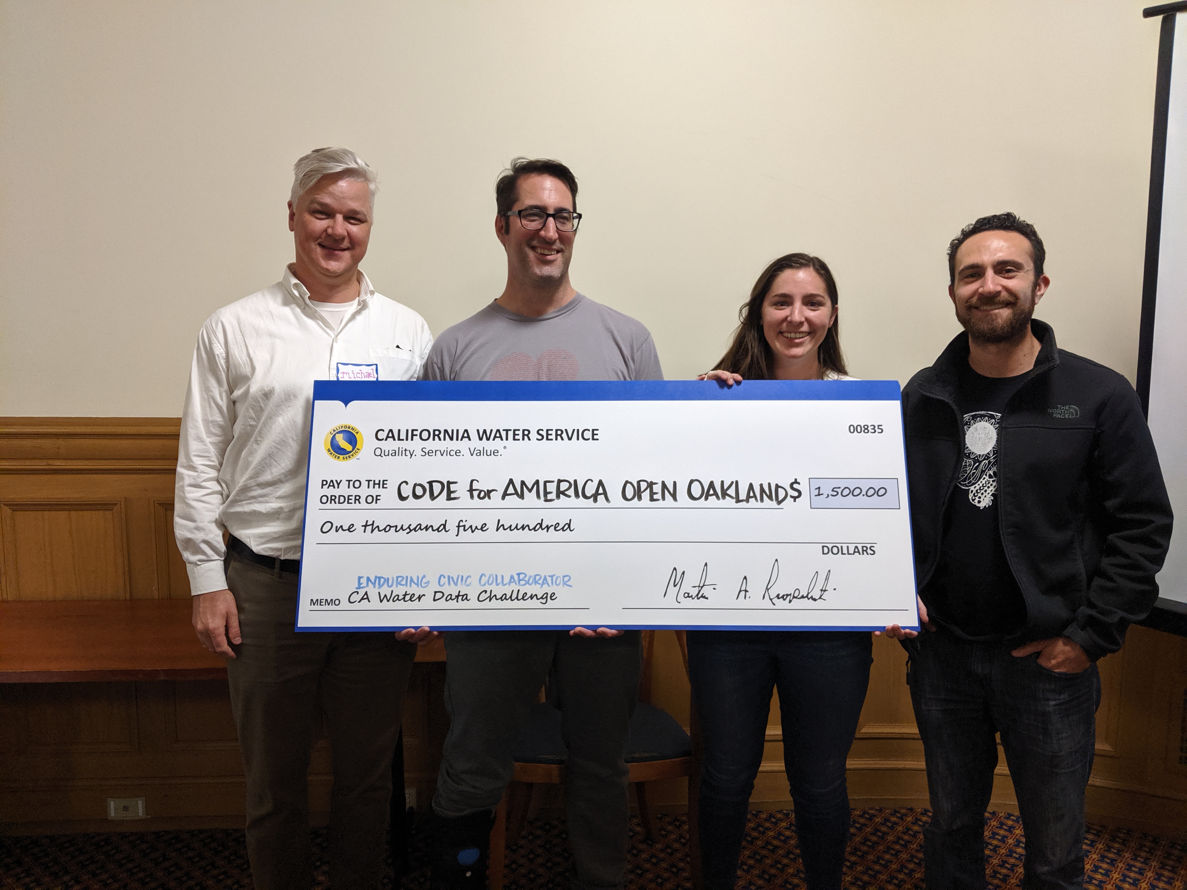 Some Water Quality team members holding award check